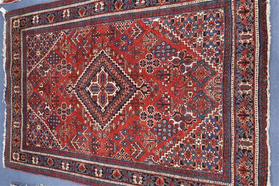 A North West Persian brick red ground rug 202 x 139cm